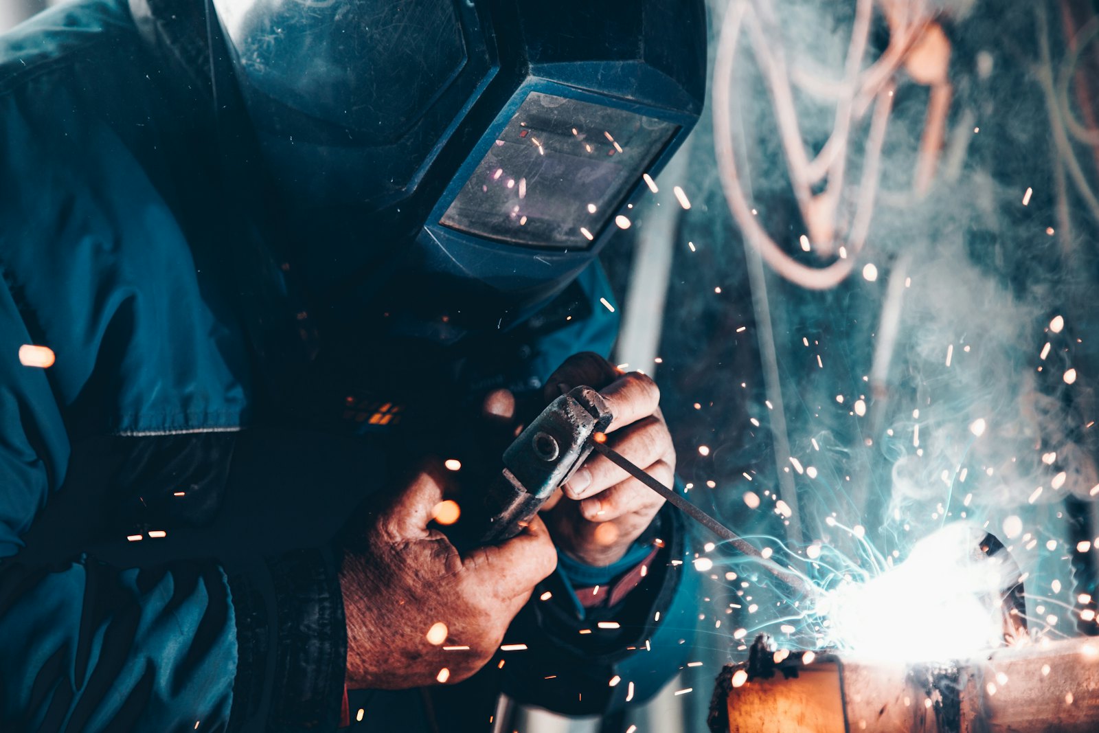 Welder fabricating a frame in the shop